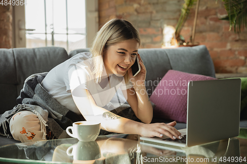 Image of Caucasian woman, freelancer during the work in home office while quarantine