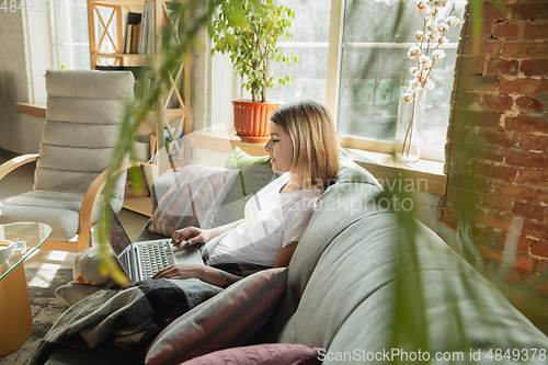 Image of Caucasian woman, freelancer during the work in home office while quarantine