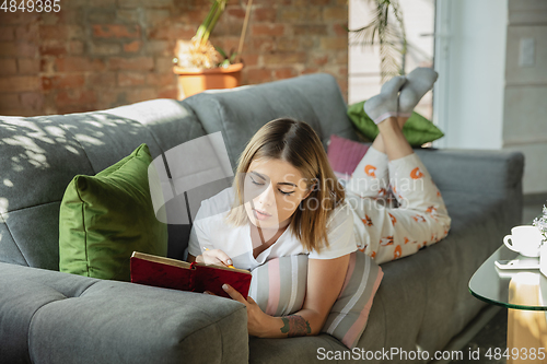 Image of Caucasian woman, freelancer during the work in home office while quarantine