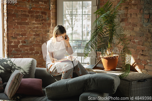 Image of Caucasian woman, freelancer during the work in home office while quarantine