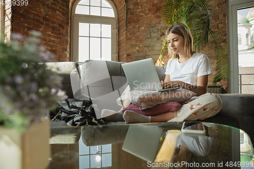 Image of Caucasian woman, freelancer during the work in home office while quarantine
