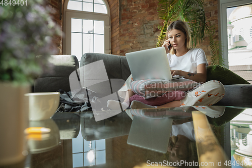 Image of Caucasian woman, freelancer during the work in home office while quarantine