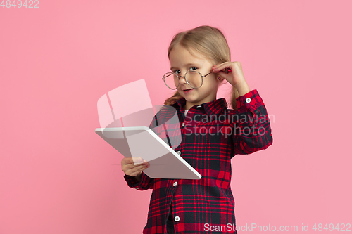 Image of Caucasian little girl\'s portrait on pink studio background