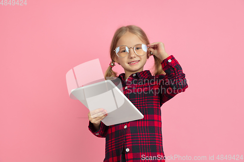 Image of Caucasian little girl\'s portrait on pink studio background