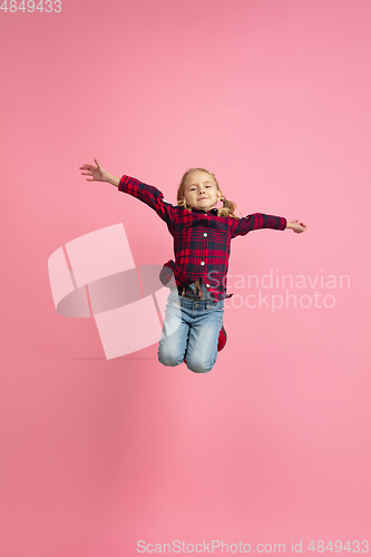 Image of Caucasian little girl\'s portrait on pink studio background