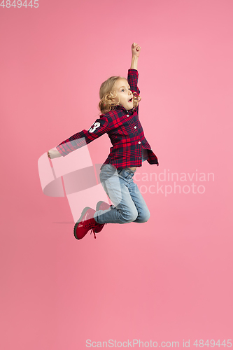 Image of Caucasian little girl\'s portrait on pink studio background