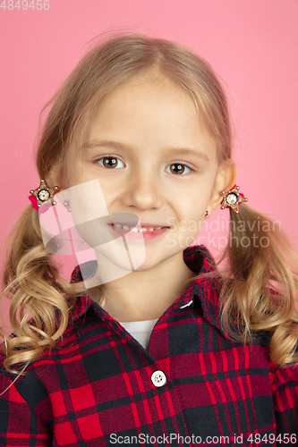 Image of Caucasian little girl\'s close up portrait on pink studio background