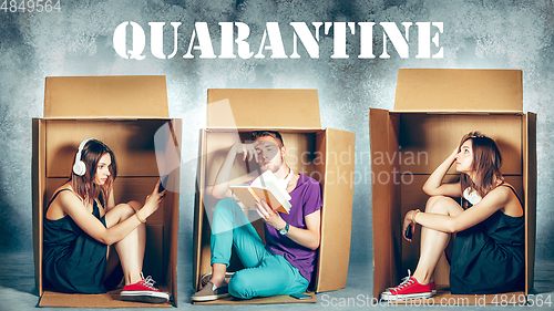 Image of People at quarantine because of coronavirus spreading - sitting inside little boxes, staying home concept