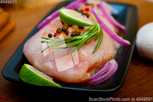 Image of fresh organic chicken breast with herbs and spices