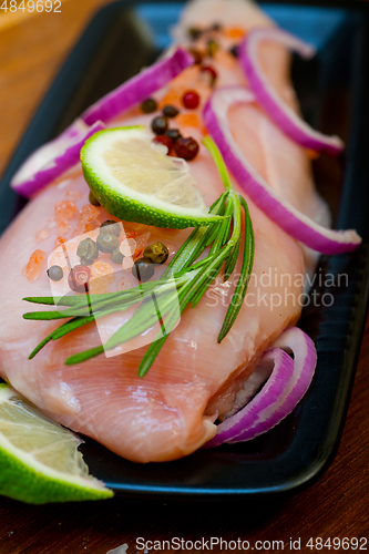 Image of fresh organic chicken breast with herbs and spices