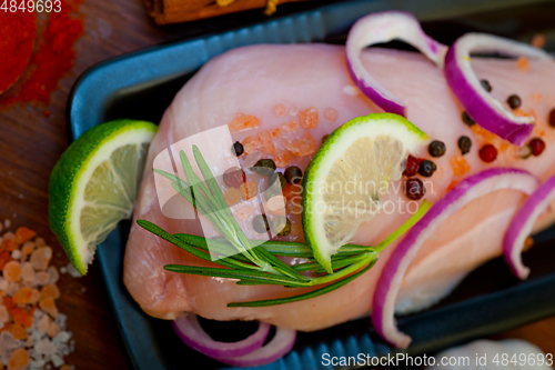 Image of fresh organic chicken breast with herbs and spices