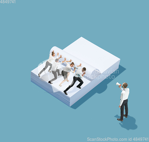 Image of High angle view of creative office on blue background - big things and little workers
