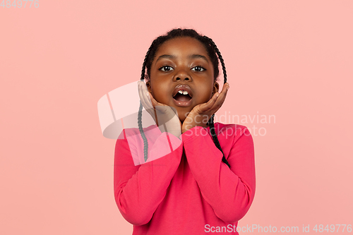 Image of Handsome african little girl portrait isolated on pink studio background with copyspace