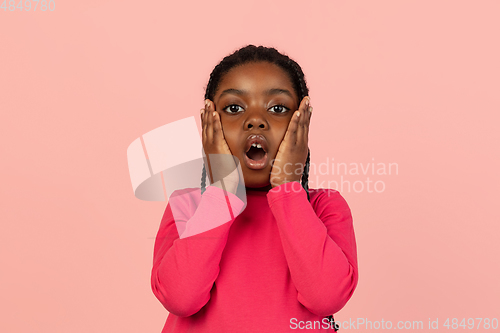 Image of Handsome african little girl portrait isolated on pink studio background with copyspace