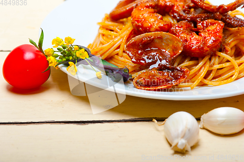 Image of Italian seafood spaghetti pasta on red tomato sauce