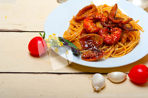 Image of Italian seafood spaghetti pasta on red tomato sauce