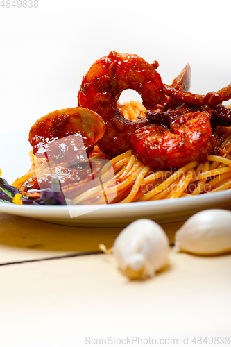 Image of Italian seafood spaghetti pasta on red tomato sauce