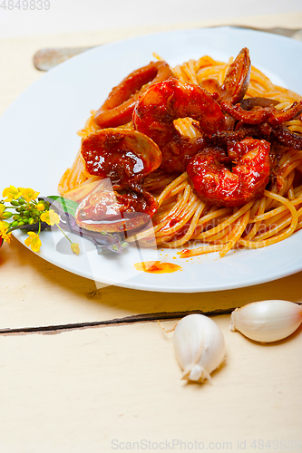 Image of Italian seafood spaghetti pasta on red tomato sauce