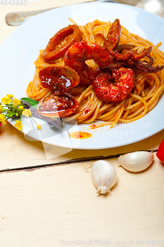 Image of Italian seafood spaghetti pasta on red tomato sauce