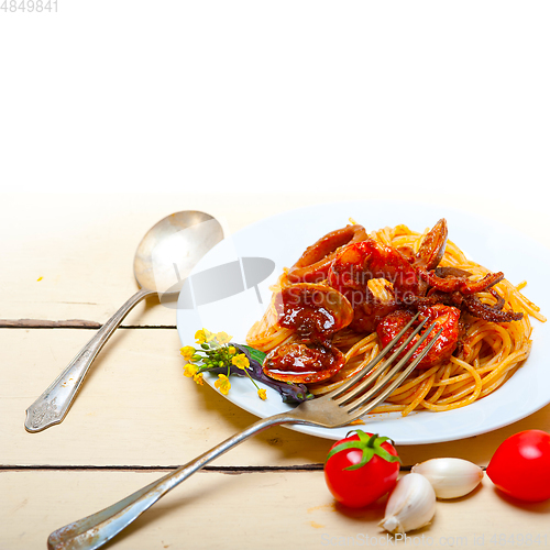 Image of Italian seafood spaghetti pasta on red tomato sauce