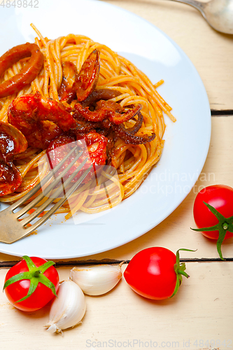 Image of Italian seafood spaghetti pasta on red tomato sauce