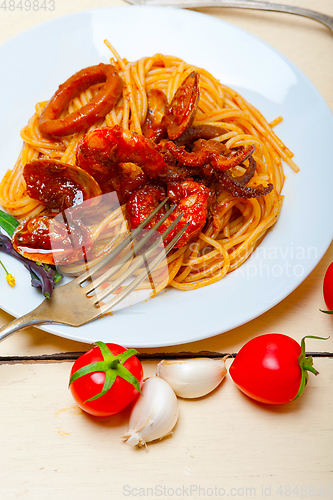 Image of Italian seafood spaghetti pasta on red tomato sauce