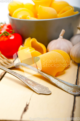 Image of Italian snail lumaconi pasta with tomatoes