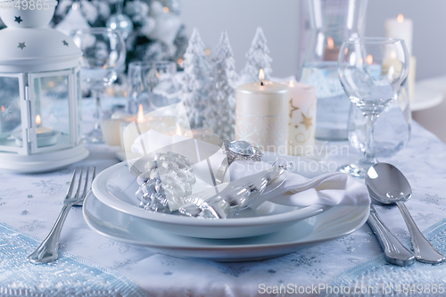 Image of Festive Christmas table in snowy white