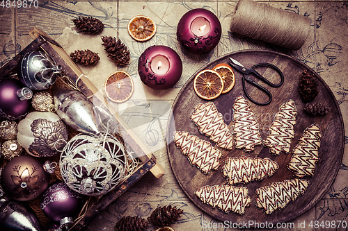 Image of Christmas cookies in tree shape with ornaments in vintage style