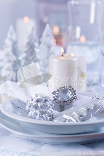 Image of Festive Christmas table in snowy white