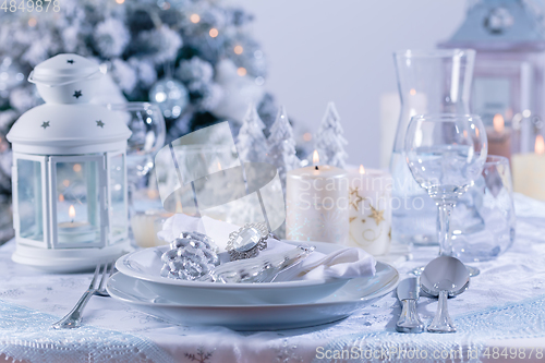 Image of Festive Christmas table in snowy white