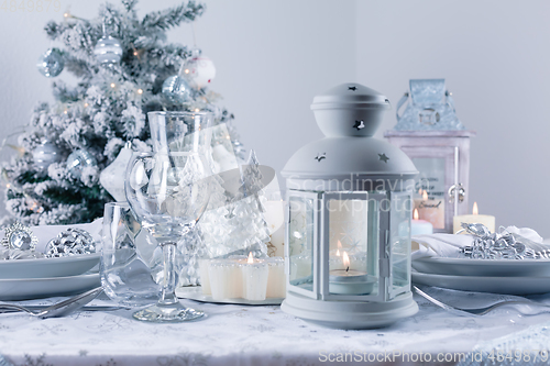 Image of Festive Christmas table in snowy white