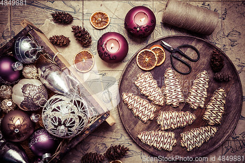 Image of Christmas cookies in tree shape with ornaments in vintage style