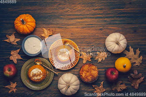 Image of Homemade small pumpkin pies with icing for Thanksgiving