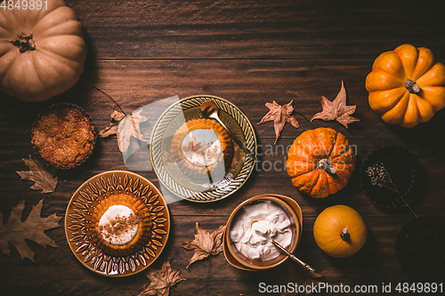 Image of Homemade small pumpkin pies with icing for Thanksgiving