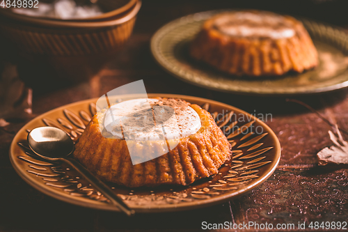 Image of Homemade small pumpkin pies with icing for Thanksgiving