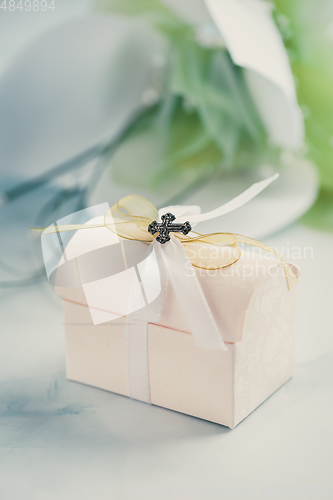 Image of First holy communion or confirmation - small present and flowers