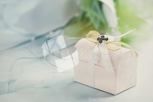 Image of First holy communion or confirmation - small present and flowers