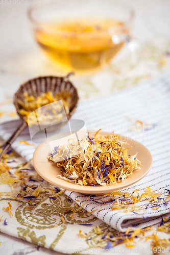 Image of Herbal tea with infuser and cupe of tea