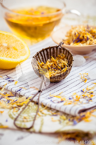 Image of Herbal tea with infuser and cupe of tea