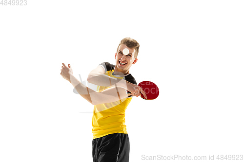 Image of Funny emotions of professional tablet tennis player isolated on white studio background, excitement in game