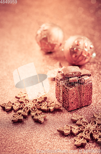 Image of Christmas glitter background with ornaments and present box 