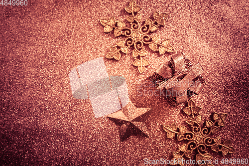 Image of Christmas glitter background with ornaments and present box 