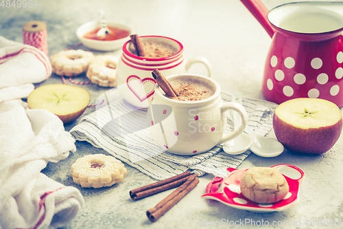 Image of Winter hot drink. Hot chocolate or cocoa with spices, cookies and fresh apple