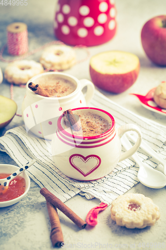 Image of Winter hot drink. Hot chocolate or cocoa with spices, cookies and fresh apple
