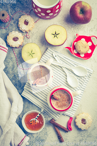 Image of Winter hot drink. Hot chocolate or cocoa with spices, cookies and fresh apple