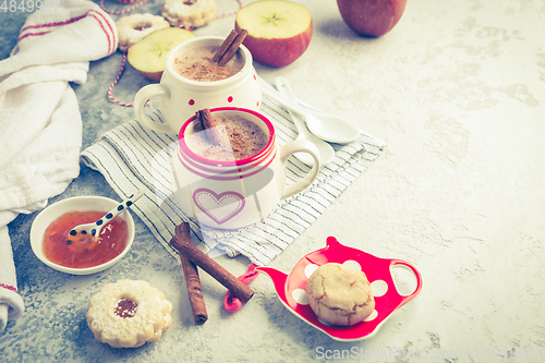 Image of Winter hot drink. Hot chocolate or cocoa with spices, cookies and fresh apple