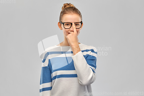 Image of smiling teenage student girl in glasses