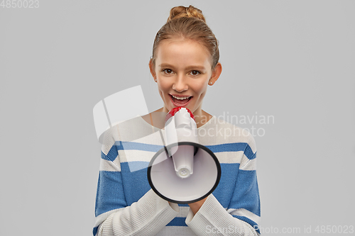 Image of teenage girl speaking to megaphone