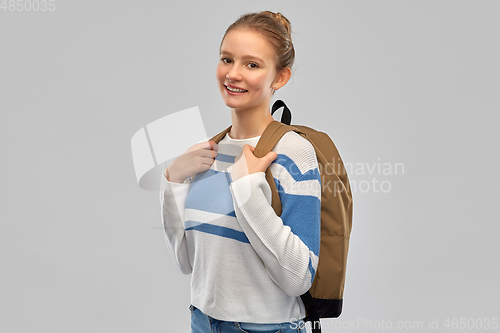 Image of smiling teenage student girl with school bag